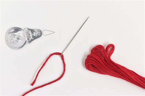 how to thread an embroidery needle: the art of needle threading